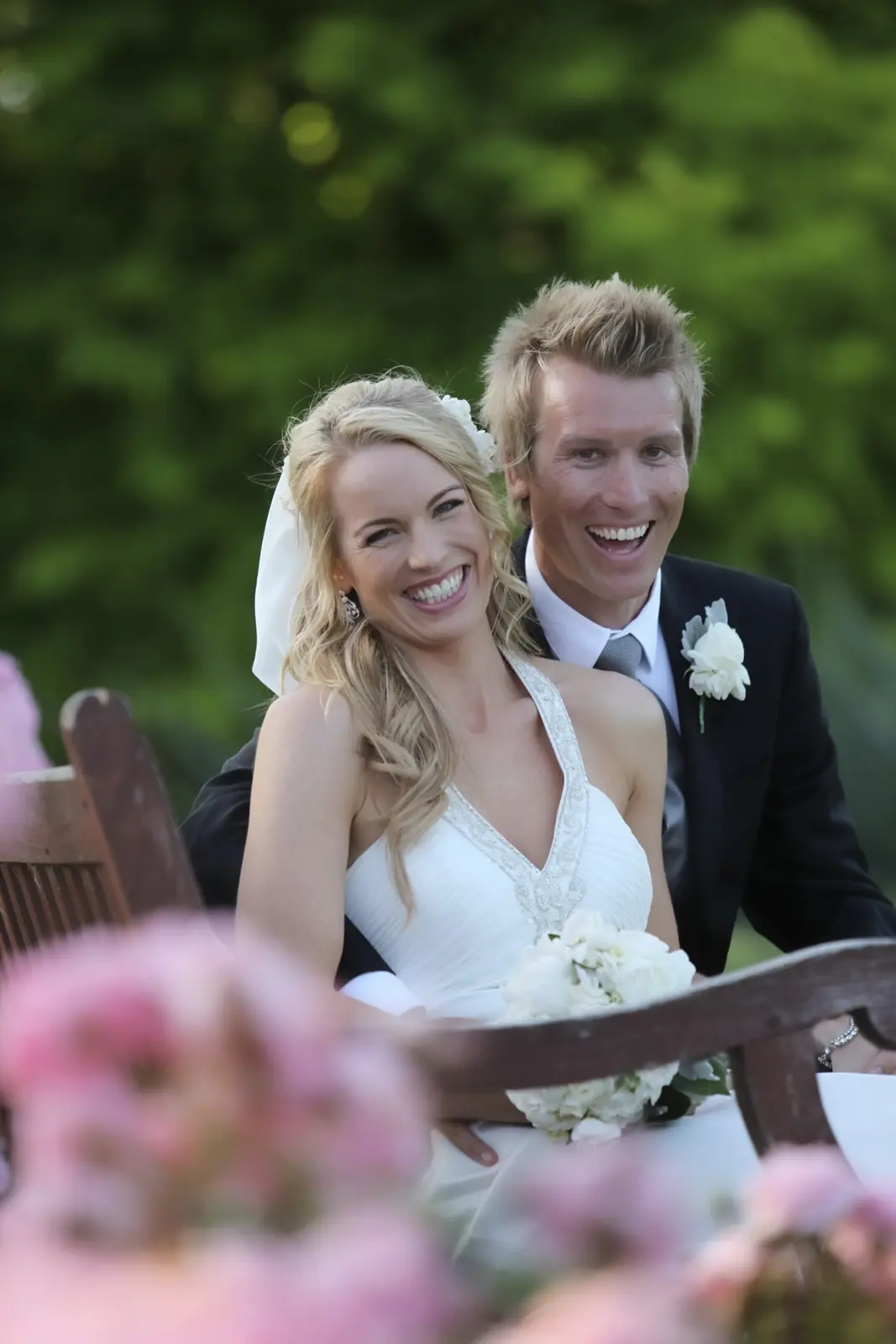 Anique and Craig laughing in a garden