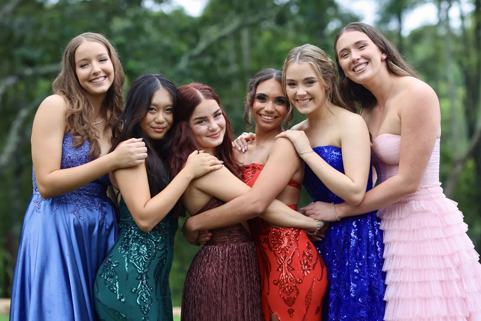 Friends in formal gowns