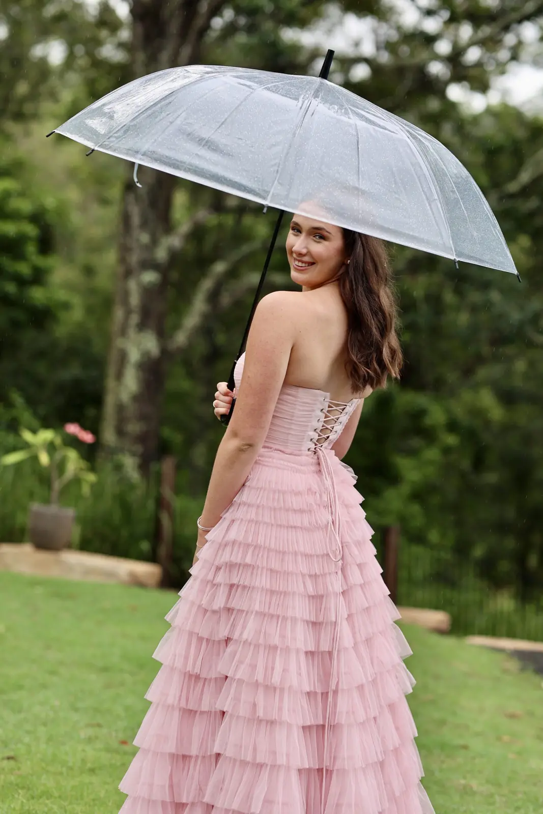Formal student with a clear umbrella