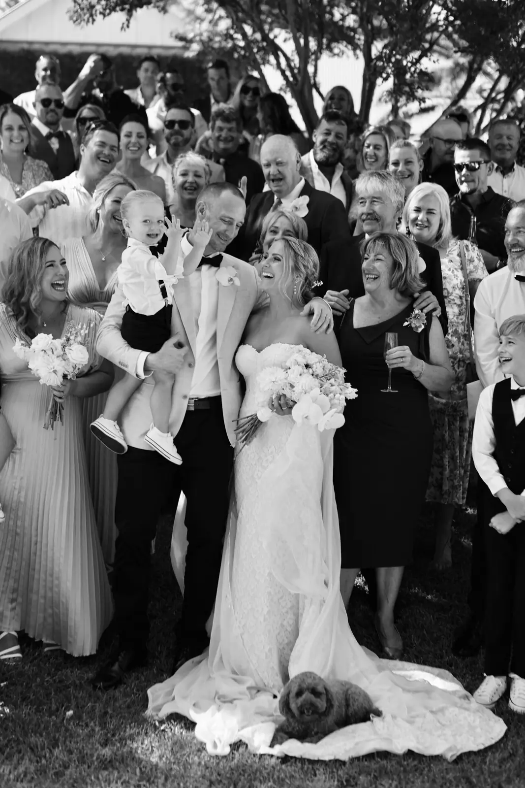 Black and white photo of a bride on a crowded dancefloor